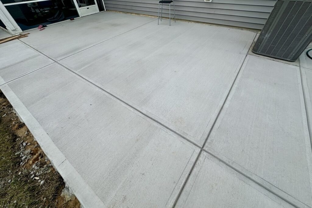 Residential concrete slab installation for patio and outdoor space
