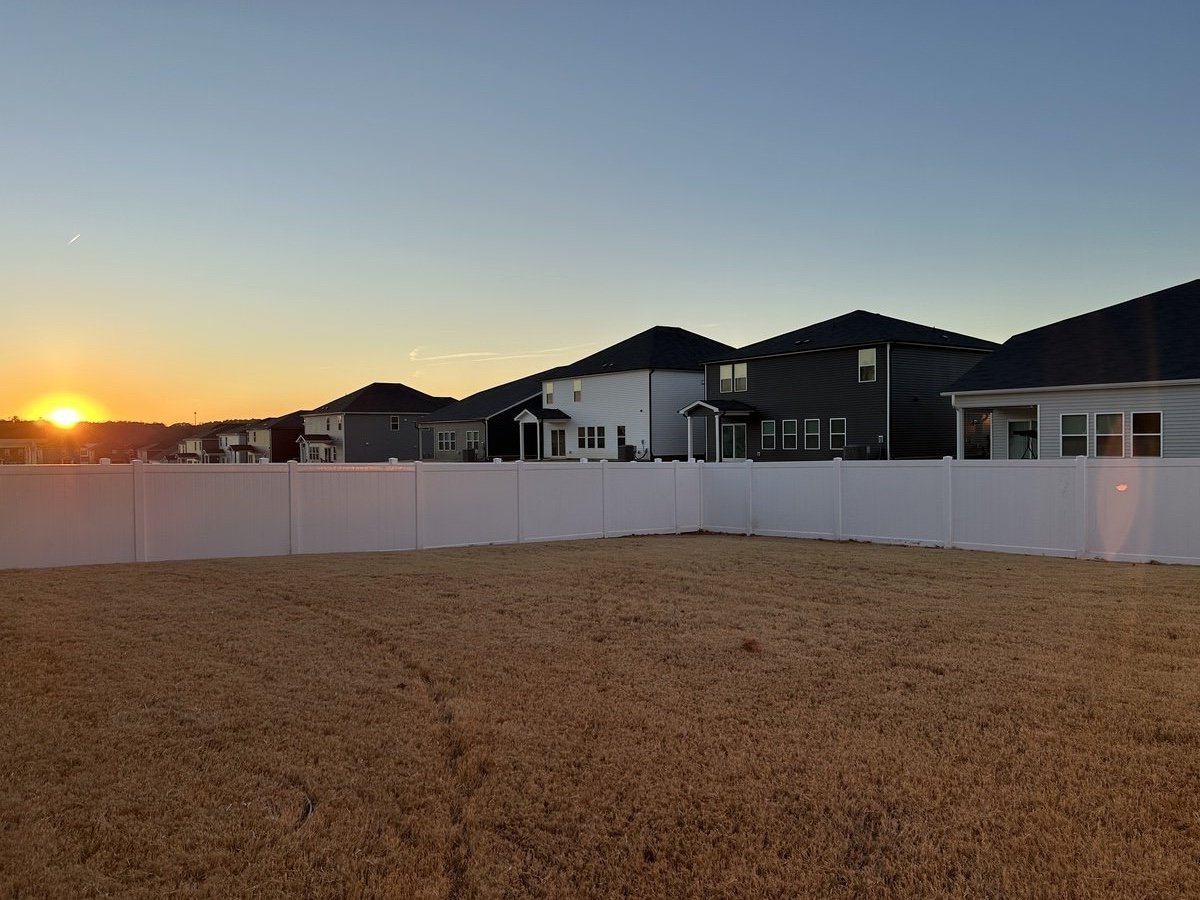 Vinyl privacy fence installation for residential backyard