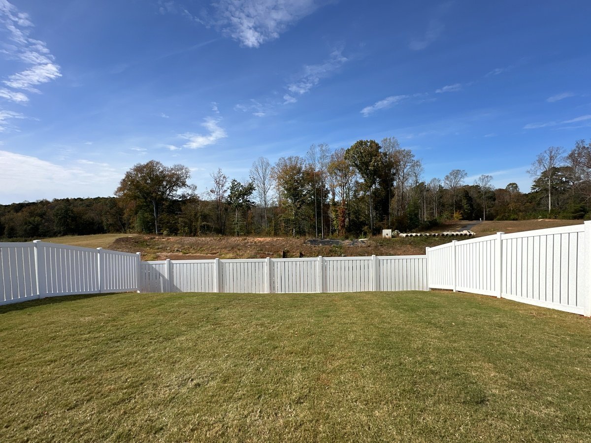 Vinyl semi privacy fence installation for large residential yard