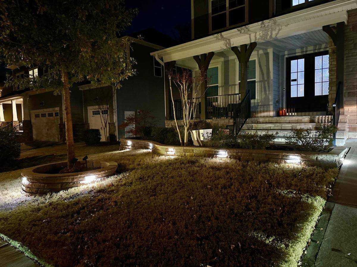 brown stone flower edging with lights in cary