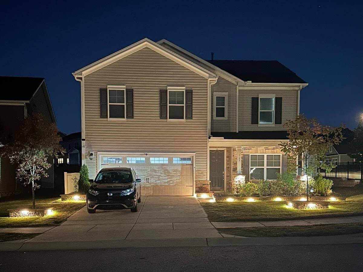 flower bed edging with lights installed in garner