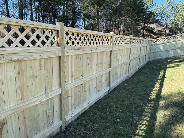 Wood privacy fence with lattice top installation